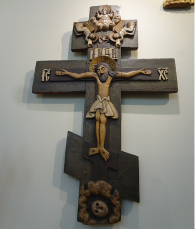 Jesus Christ with a Komi-Permian face. XVII century Worship Cross. Perm State Art Gallery. Home exhibition. Photo taken by the authors