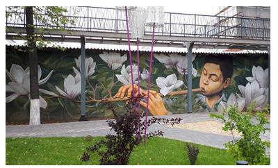 Graffiti "Boy with Kurai" is placed in the nifty space Art-Kvadrat (10, M. Karim Street). The author of the work is Kazan artist R. Salemgareev, aka Rustam QBic