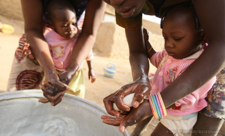 Mother and child are motivated through media to watch hands before and after eating